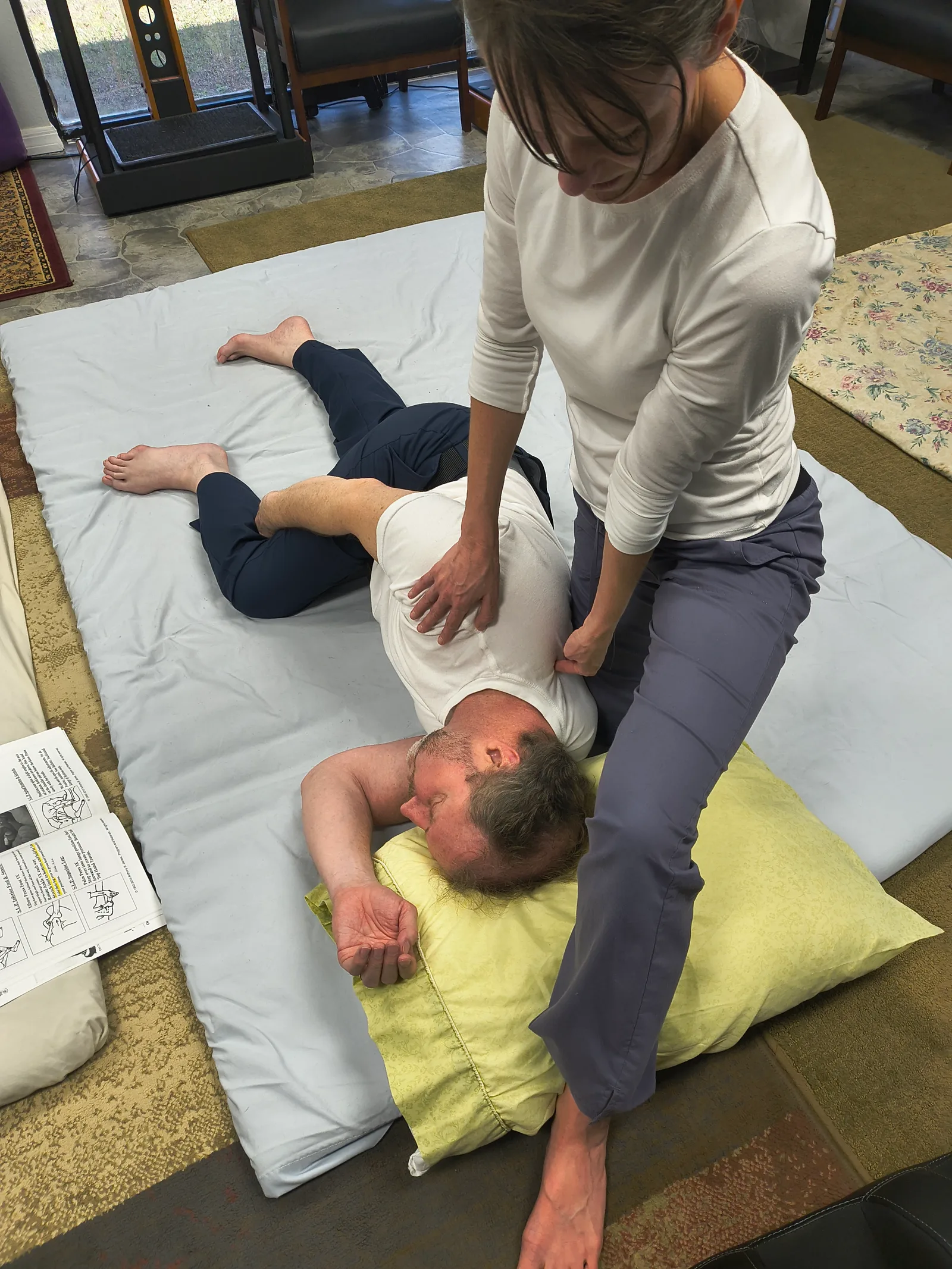 SomaVeda Thai Yoga assisted side-lying posture in class
